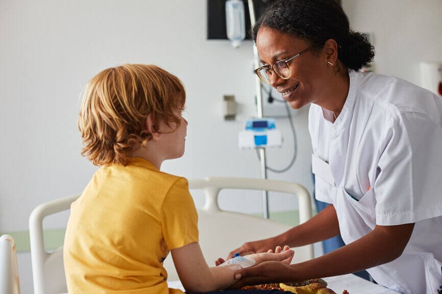 Doctor giving attention and care to a child in a hospital room