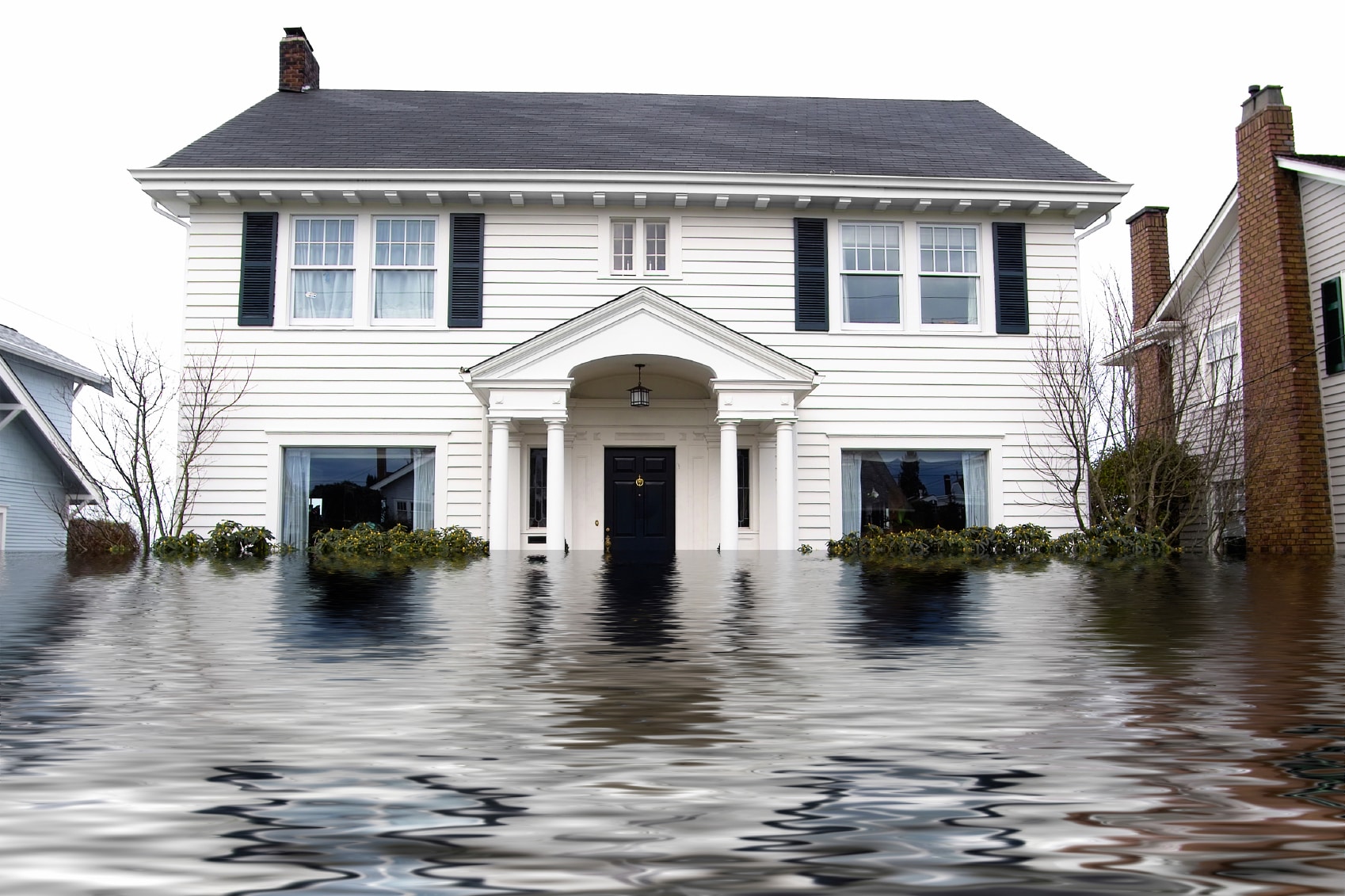 Front of residential home with water flooding