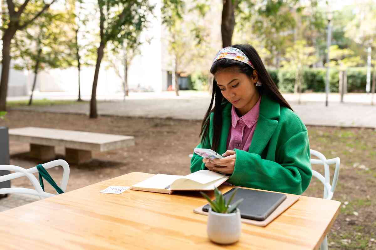 A person sitting at a table with a laptop.