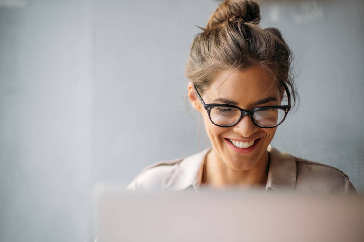 Businesswoman with glasses working on computer