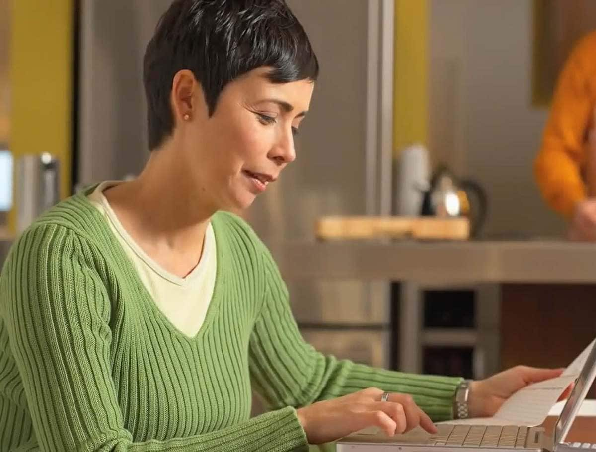 woman working on a laptop computer in a café