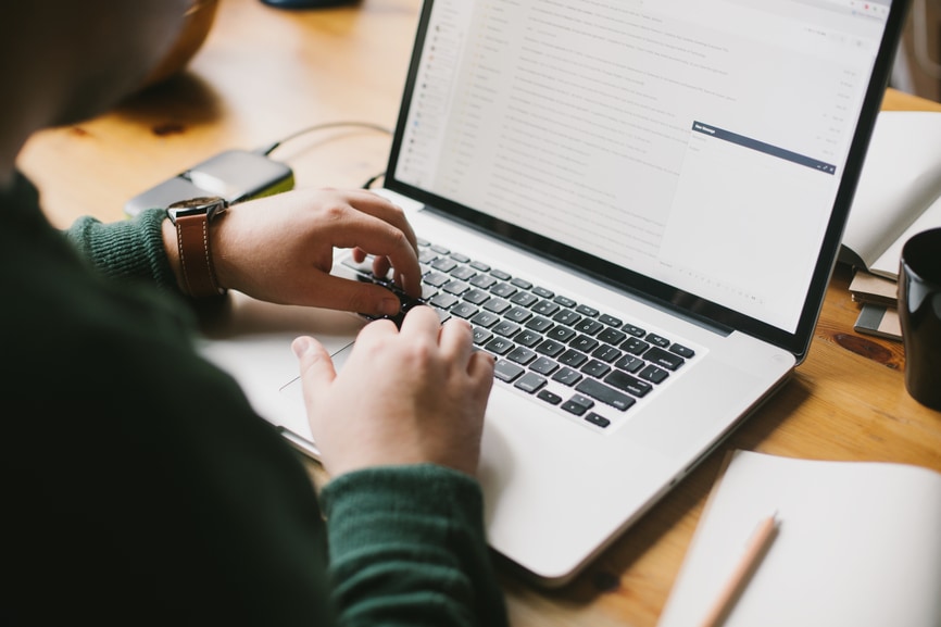 Man checking emails on latptop