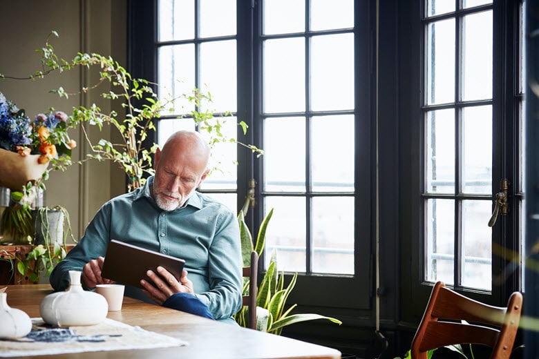 Elderly man using a tablet