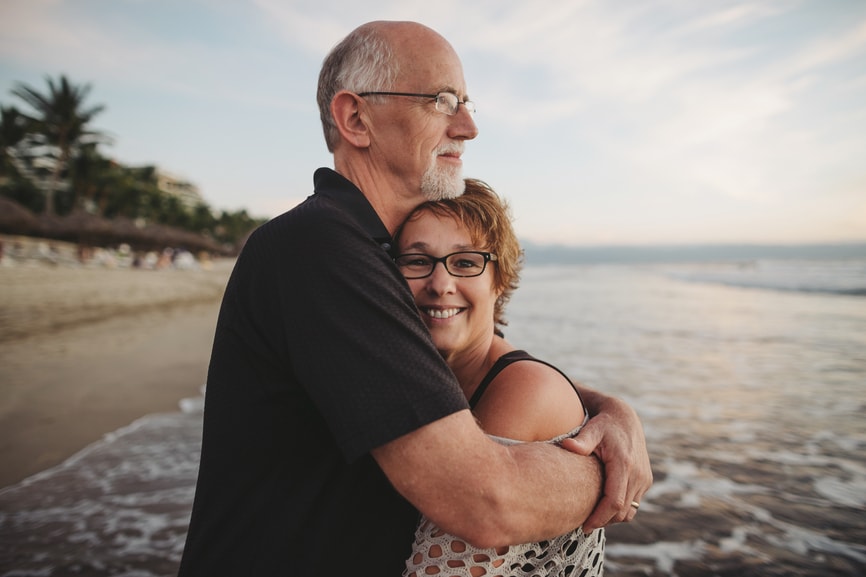 Senior couple hugging on the beach