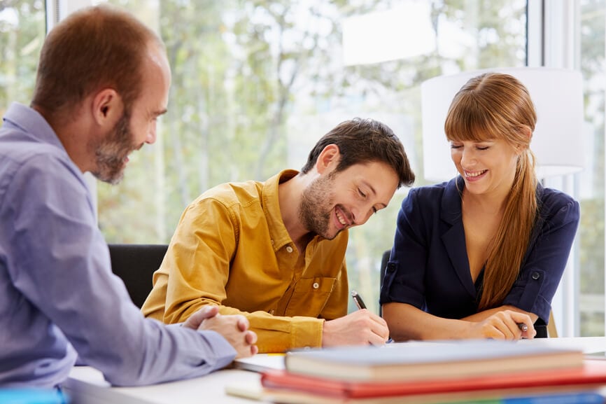 Man and woman consulting with a professional tax preparer.