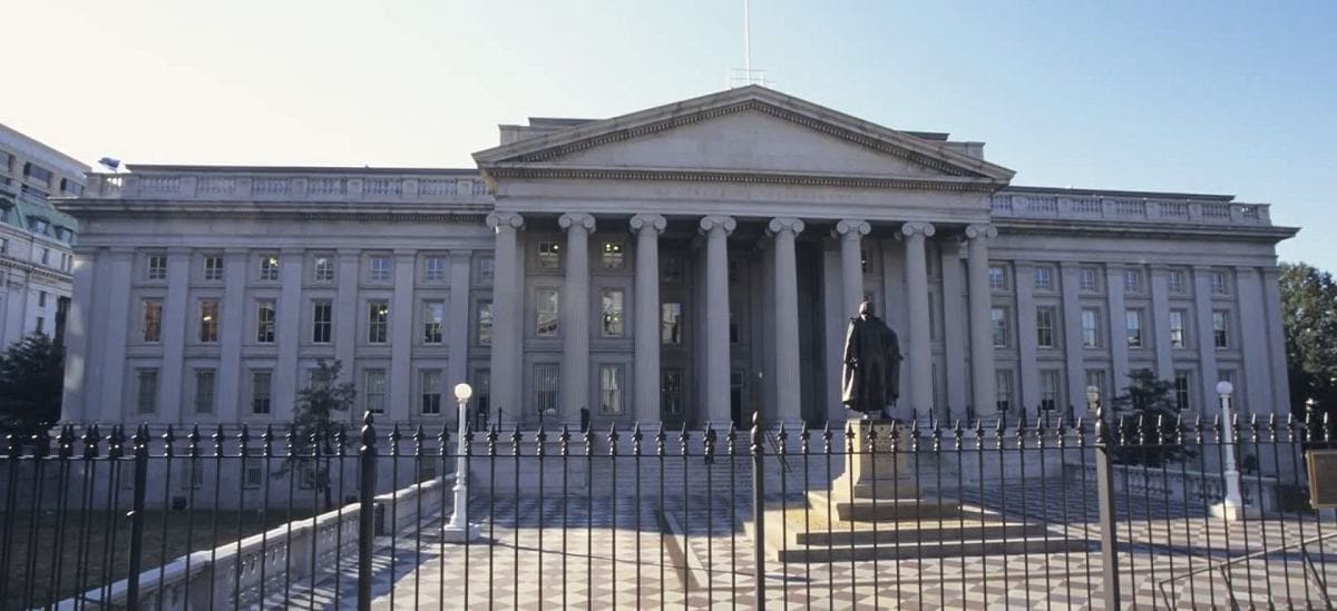 the front of the treasury building with statue