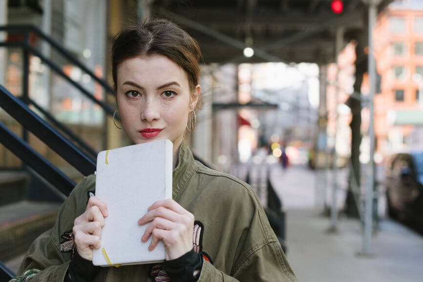 millennial woman with a notepad