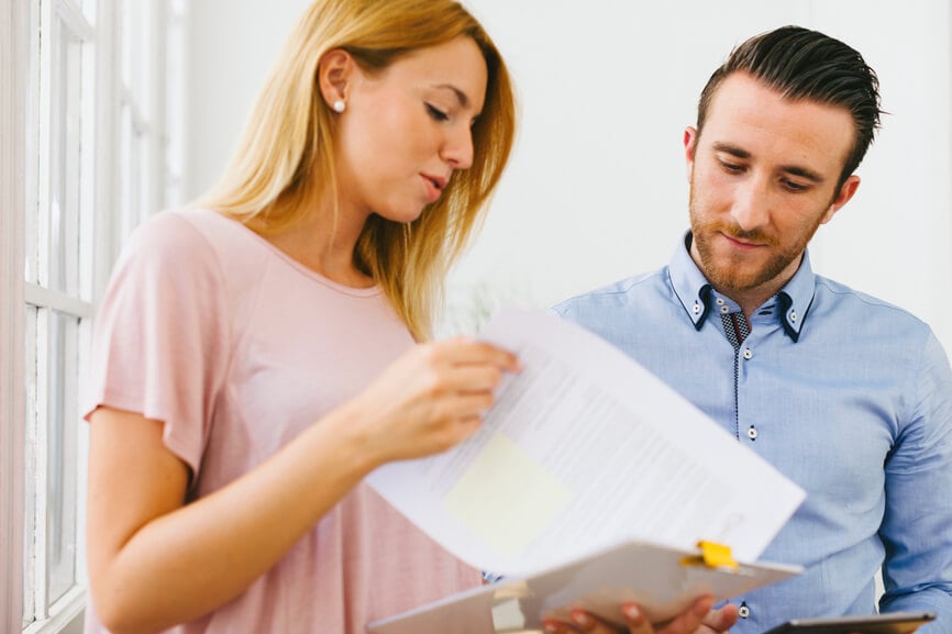 A couple reviewing Power of Attorney paperwork together.