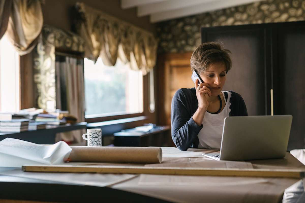 Businesswoman talks on a smartphone in an office