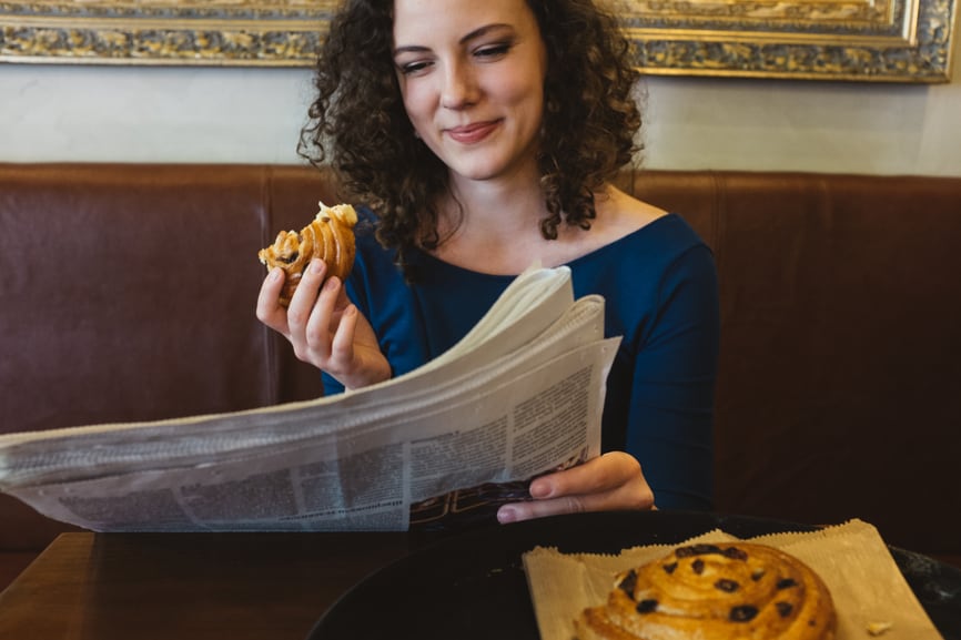 Casually reading a newspaper