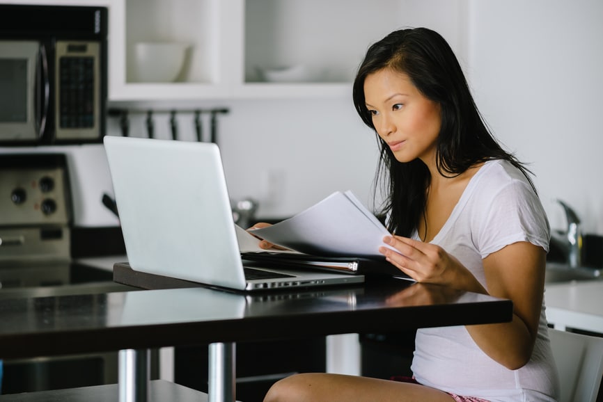 Asian woman working on laptop computer