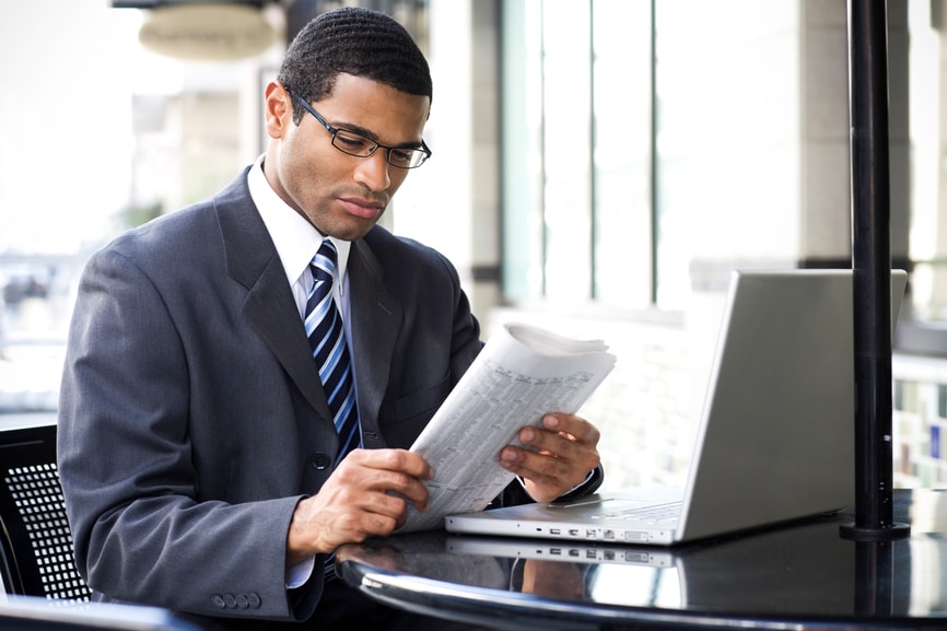 Businessman reading the newspaper