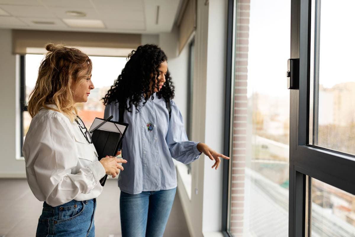 Female real estate agent with female client in a rental property