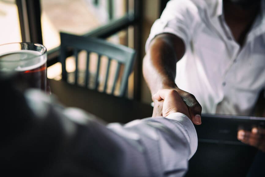 two men shaking hands