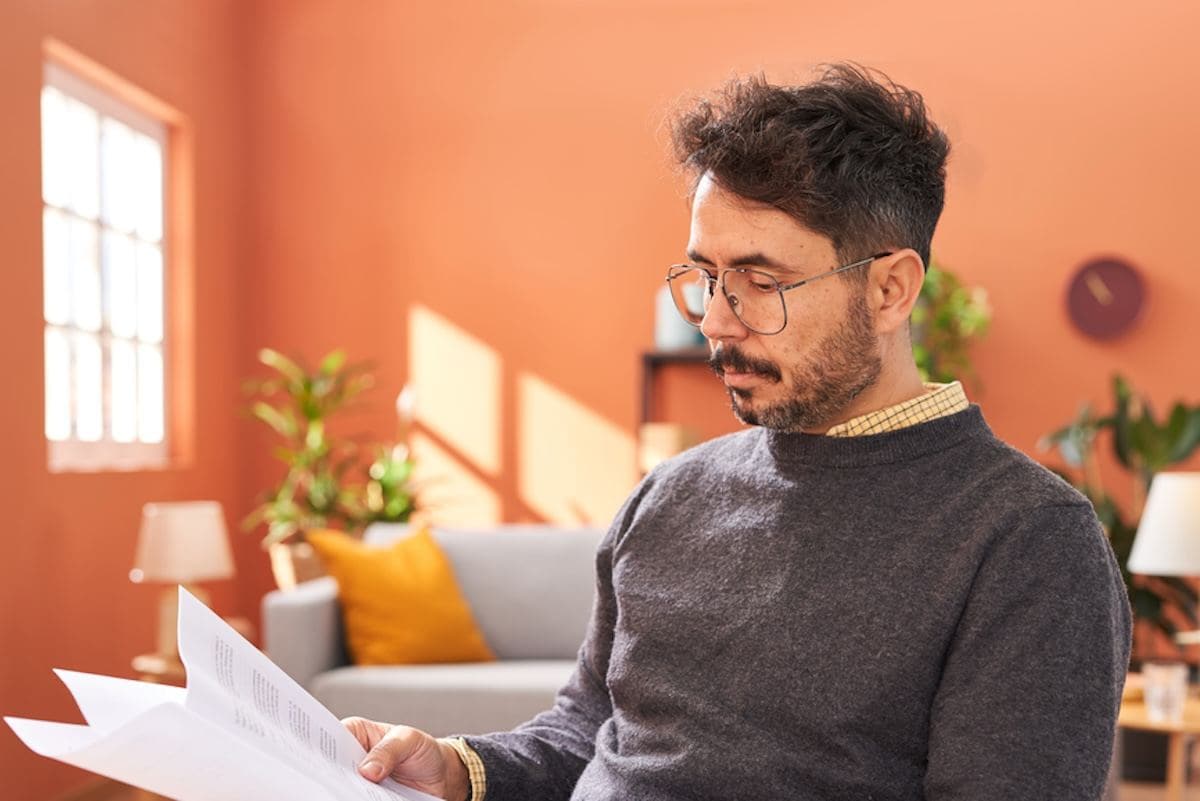 A person sitting in front of a laptop computer.