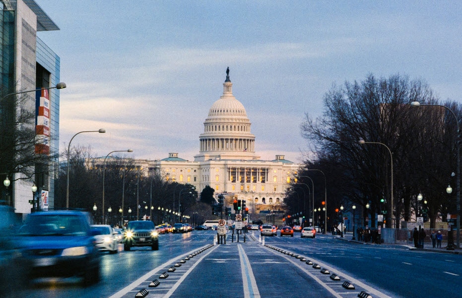 streets of Washington DC with the Capitol in the distance