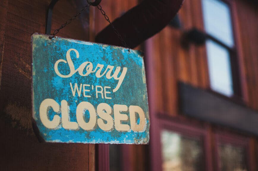 a closed sign outside of a shop
