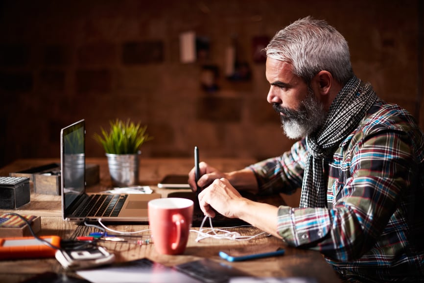 Freelancer working on graphic design pad