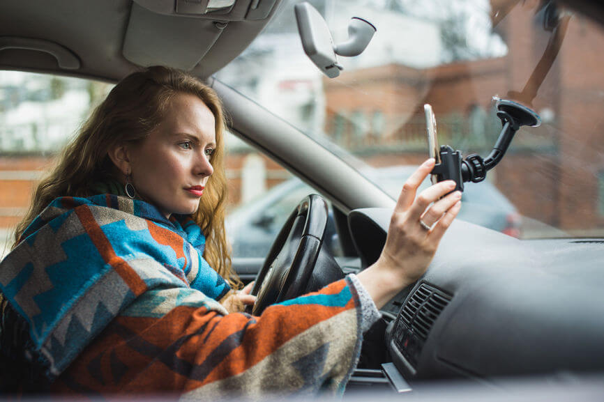 woman driver looking at gps