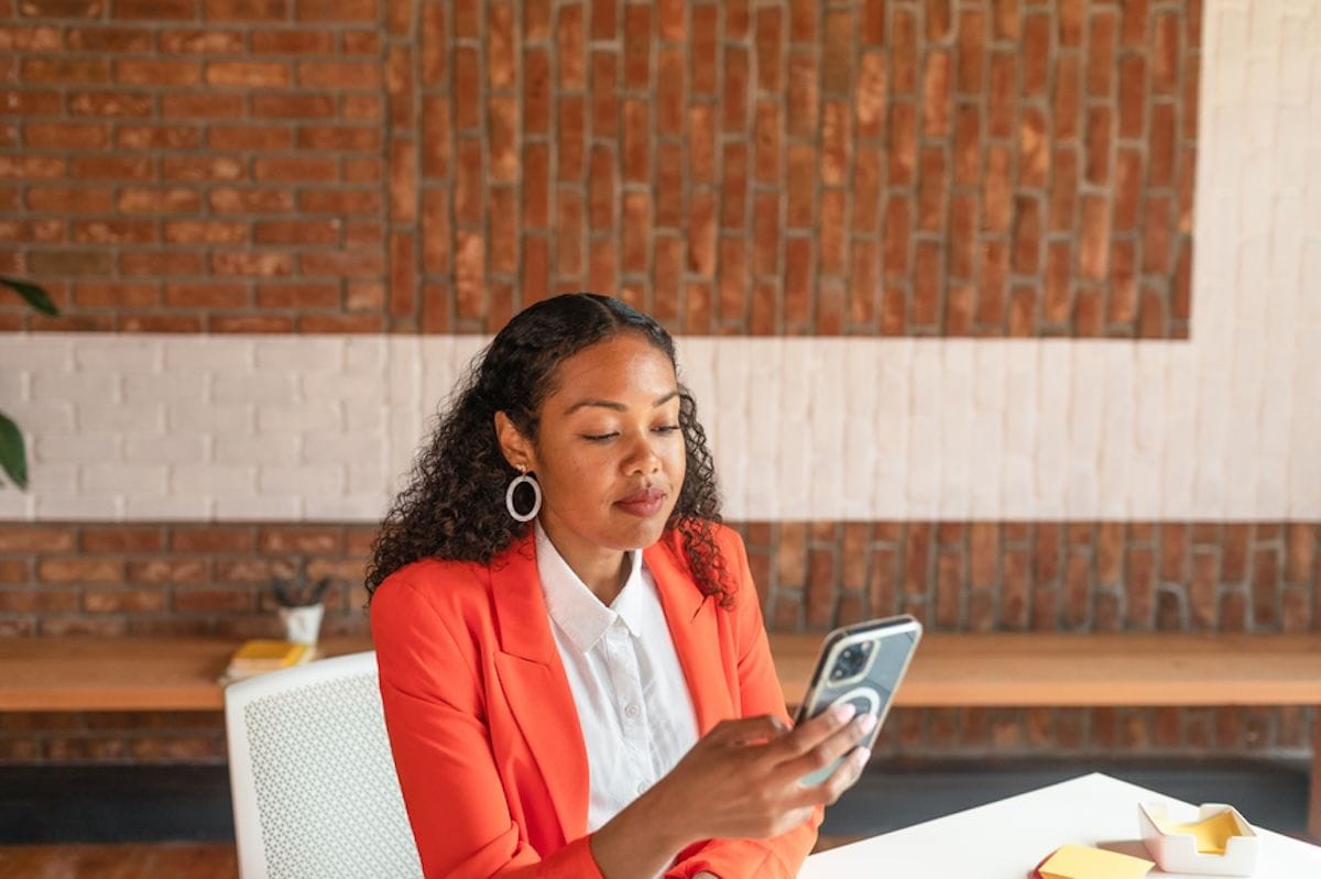 A person sitting at a table with a laptop.