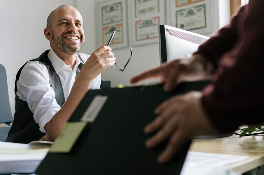 Man smiling at office desk