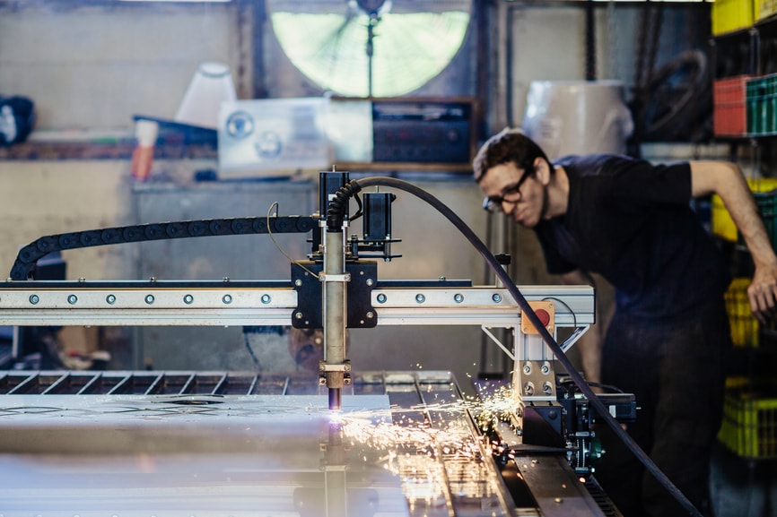 Man working on manufacturing machine