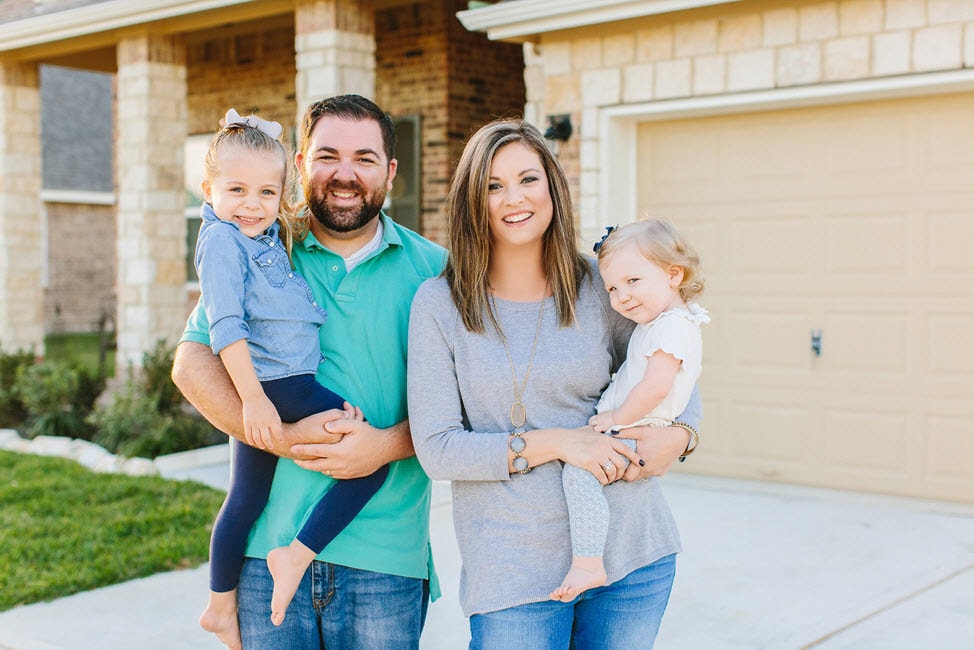 Couple holding children