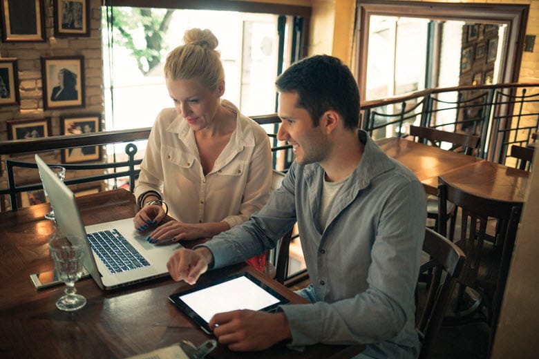 Married couple sitting at computer