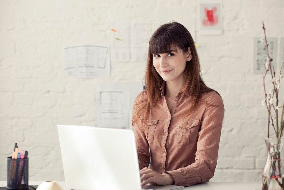 Woman using a laptop in a studio