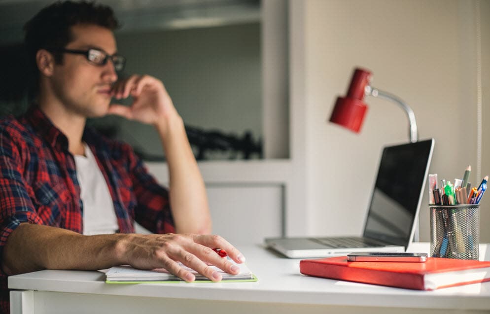 Young man in home office