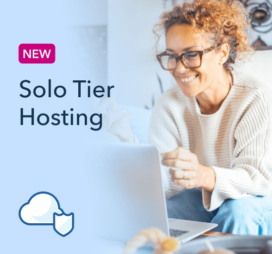 A black and white photo of a person sitting on a toilet.