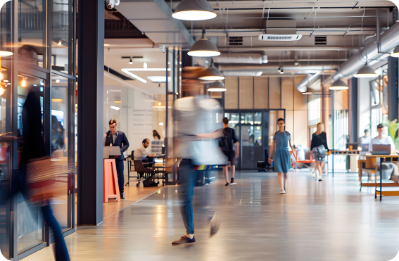 A group of people walking around a building.