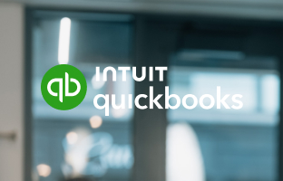 quickbooks logo on top of a photo that is really busy