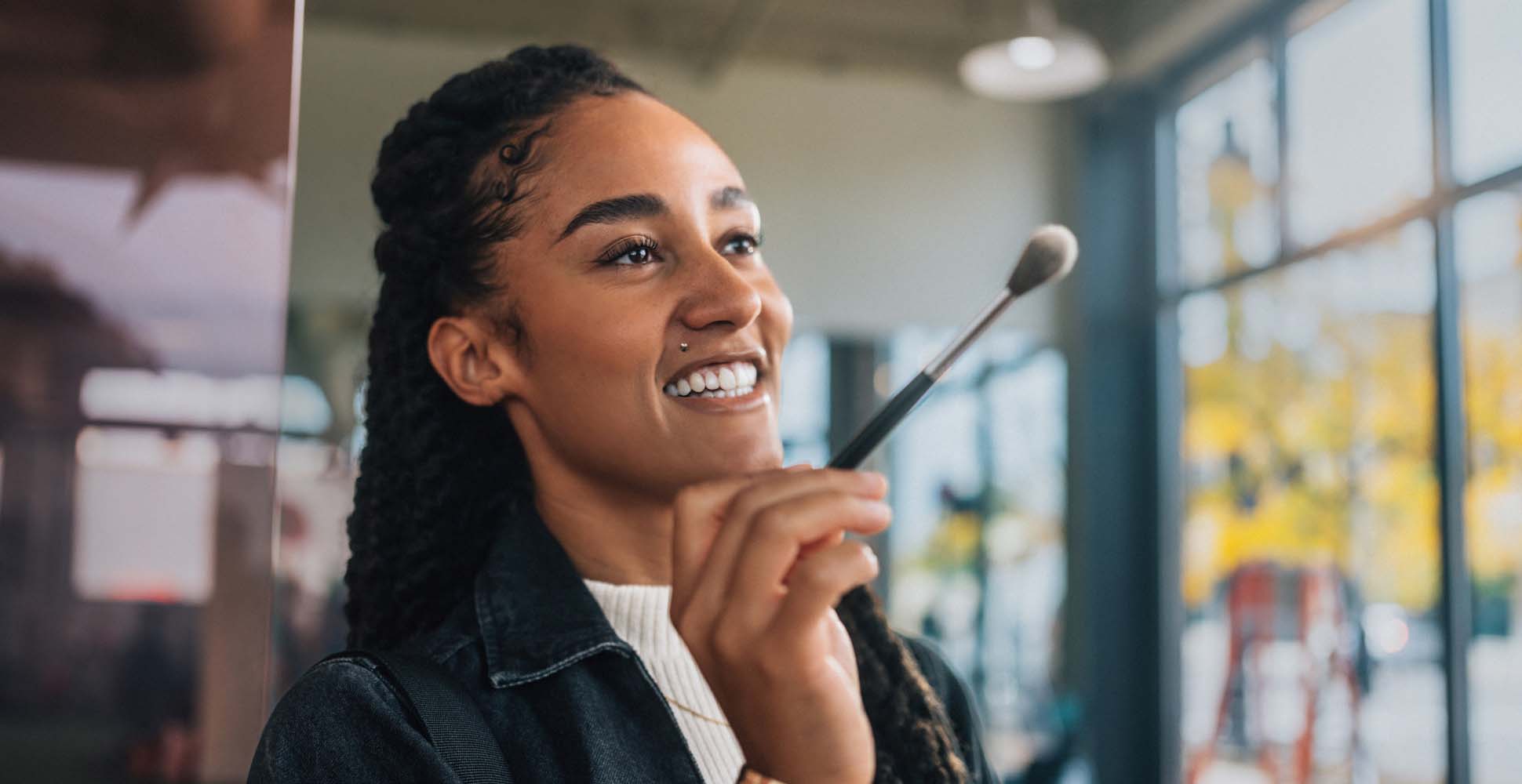 Female make-up artist holding brush