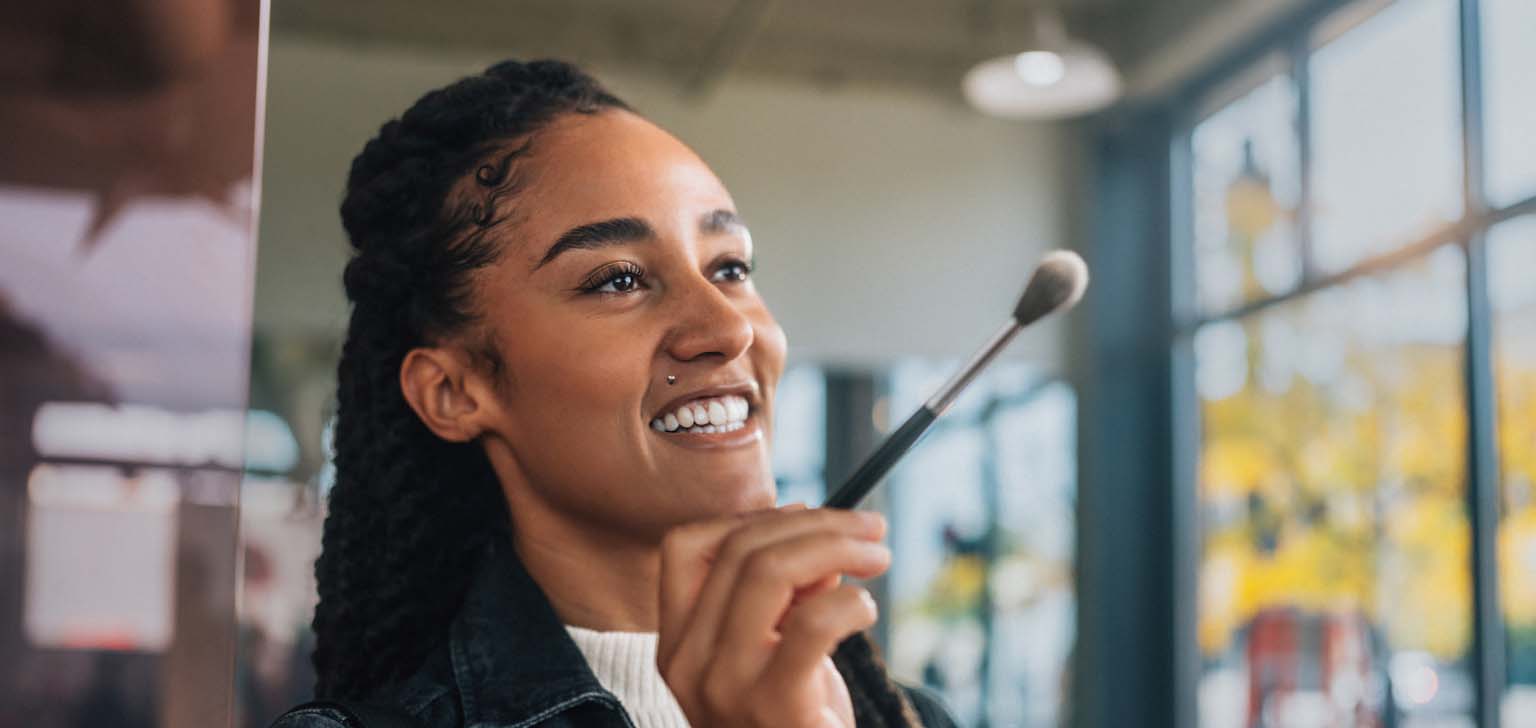 Female make-up artist holding brush