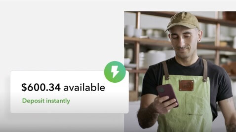 image of a man looking at his phone on the right and a quickbooks UI on the left notifying him money deposited instantly