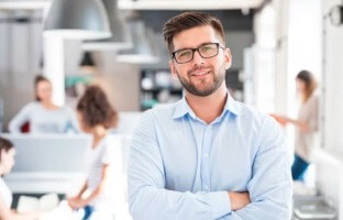 Corporate looking stock photo of person with folded arms.