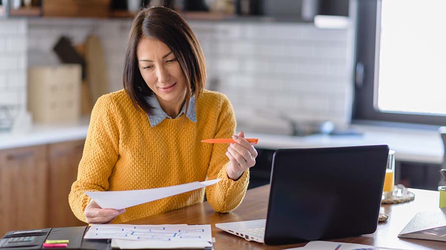 Woman going through her small business taxable benefits.