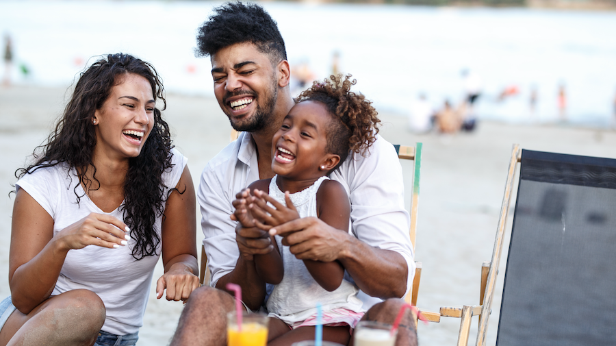 Family unwinding on vacation at the beach.