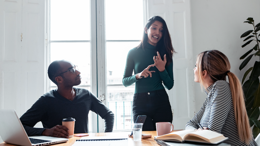 Businesswoman providing feedback to her team.