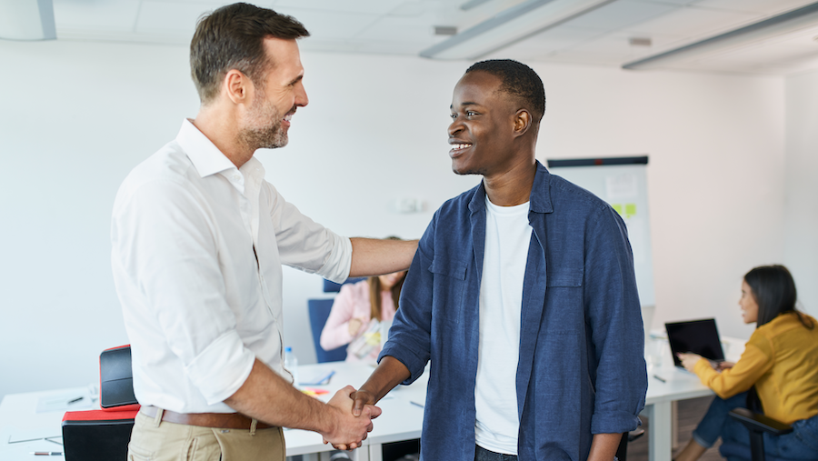 Accountant welcoming a new member of the staff.