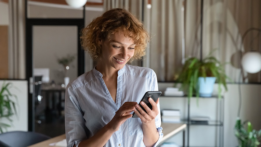 A person is looking at her cell phone.