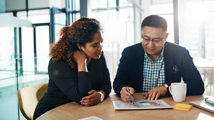 Bookkeeper offering advice to a businesswoman.