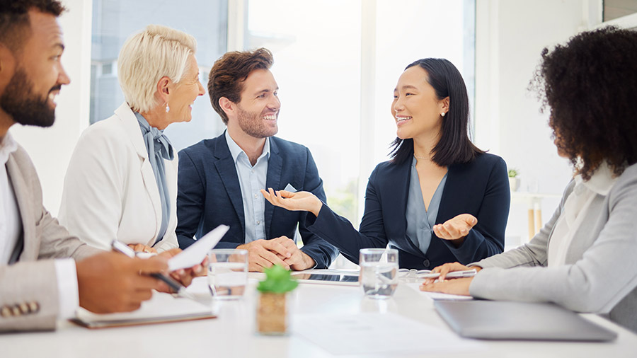 A group of people sitting around a table.