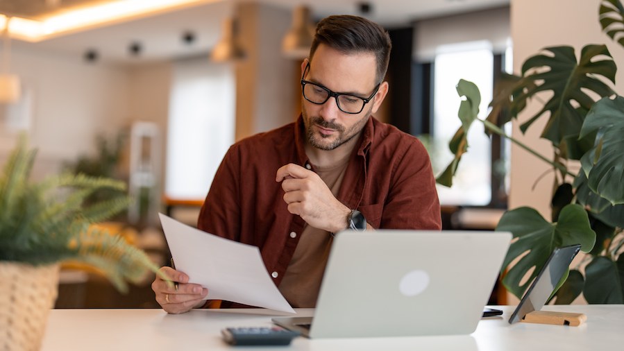 Small business owner reviewing his taxes.