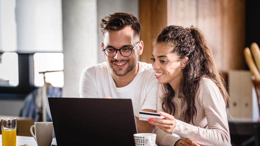 Two people discussing gift card purchases.