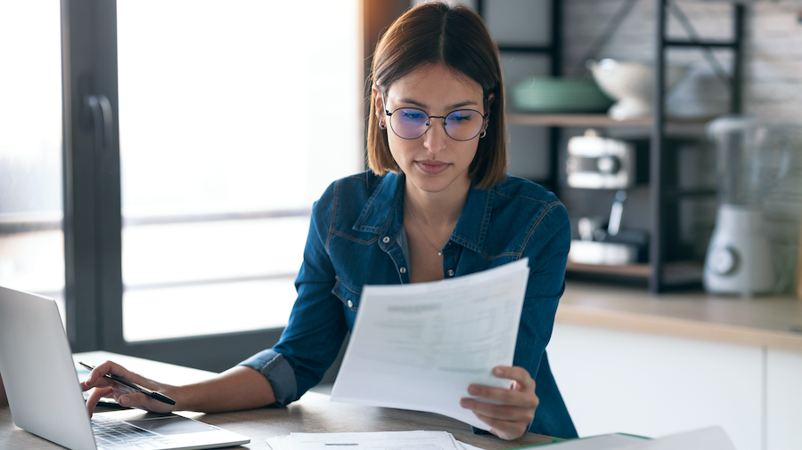 Accountant looking over her invoicing, while on QuickBooks Online Advanced.