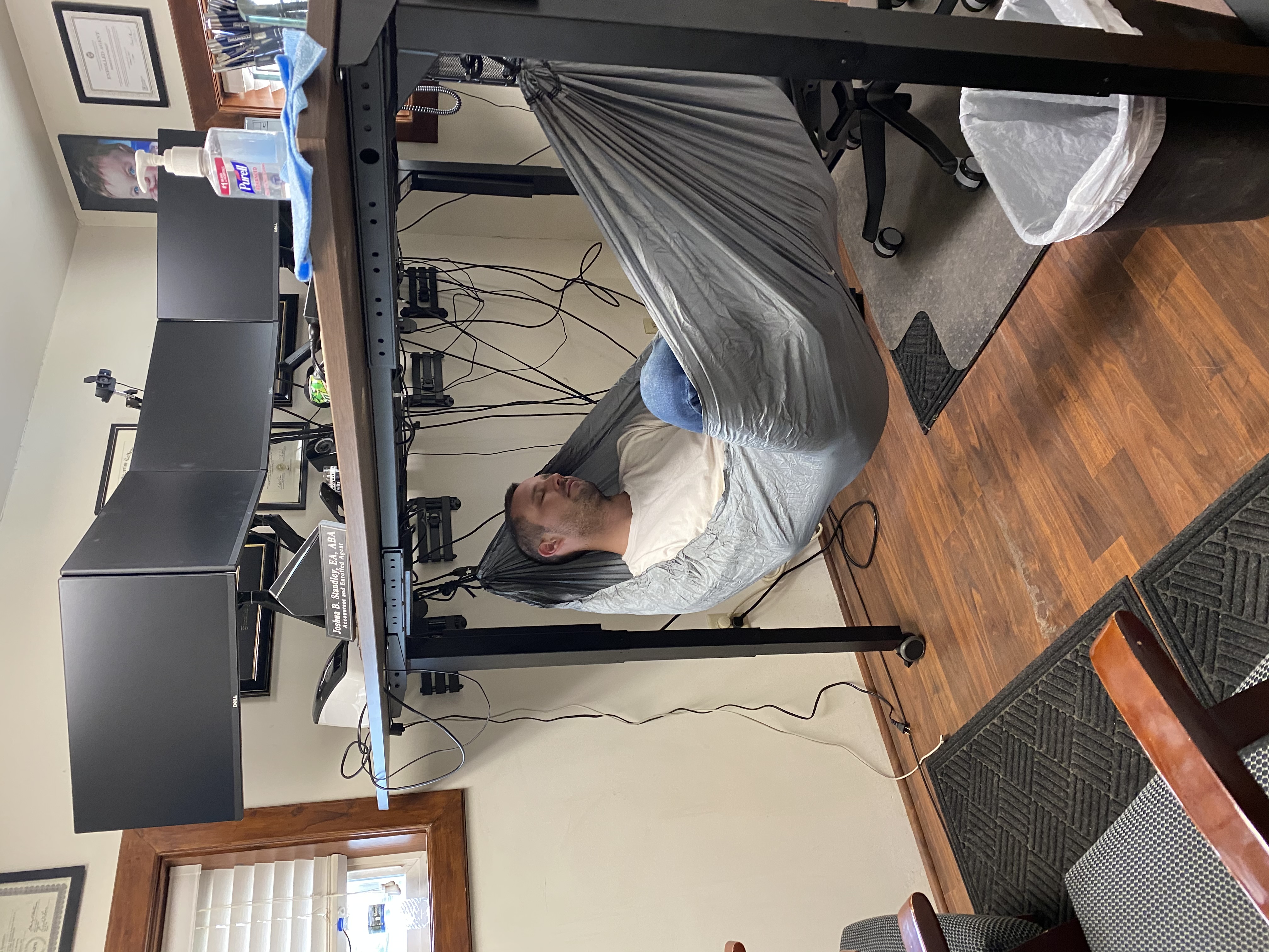 Josh Standley in a hammock in his office.