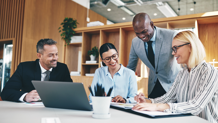 Group of accountants meeting and laughing together.