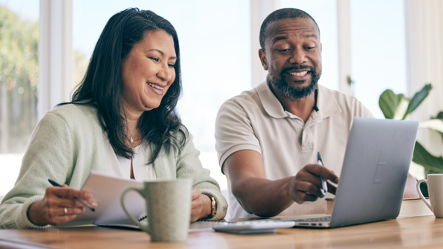 Two people discussing financial plans for their practice.